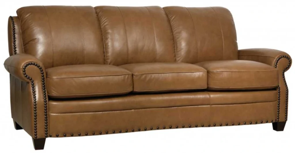 Premium Italian leather furniture - Bennet sofa in warm cognac brown featuring hand-applied nailhead trim, rolled arms, and classic design elements perfect for traditional or transitional homes